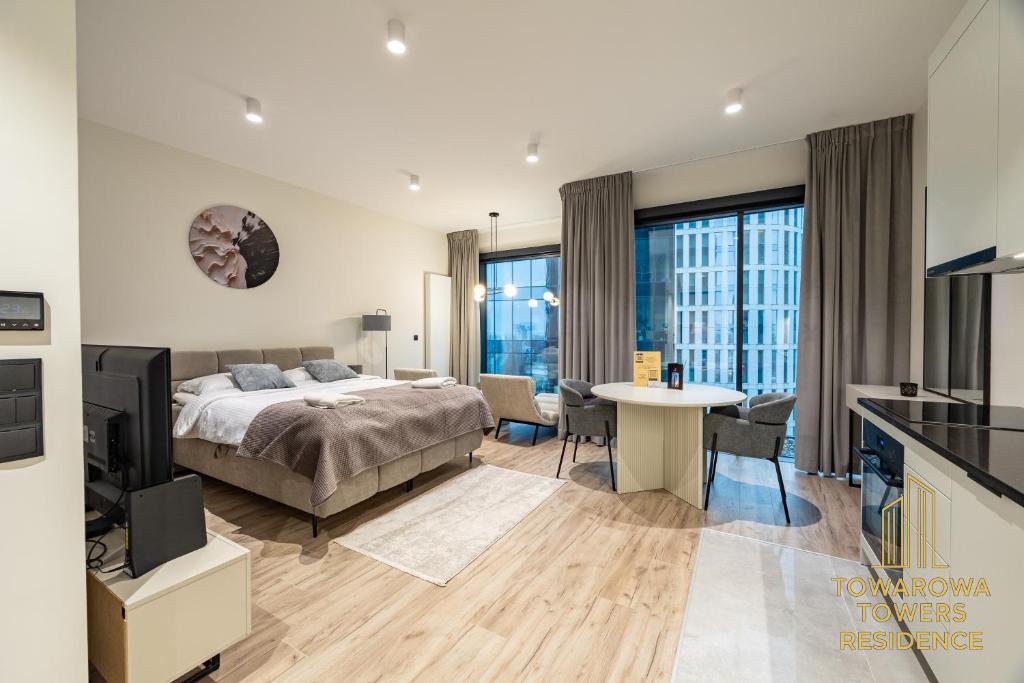 En eller flere senge i et værelse på Towarowa Towers Suites