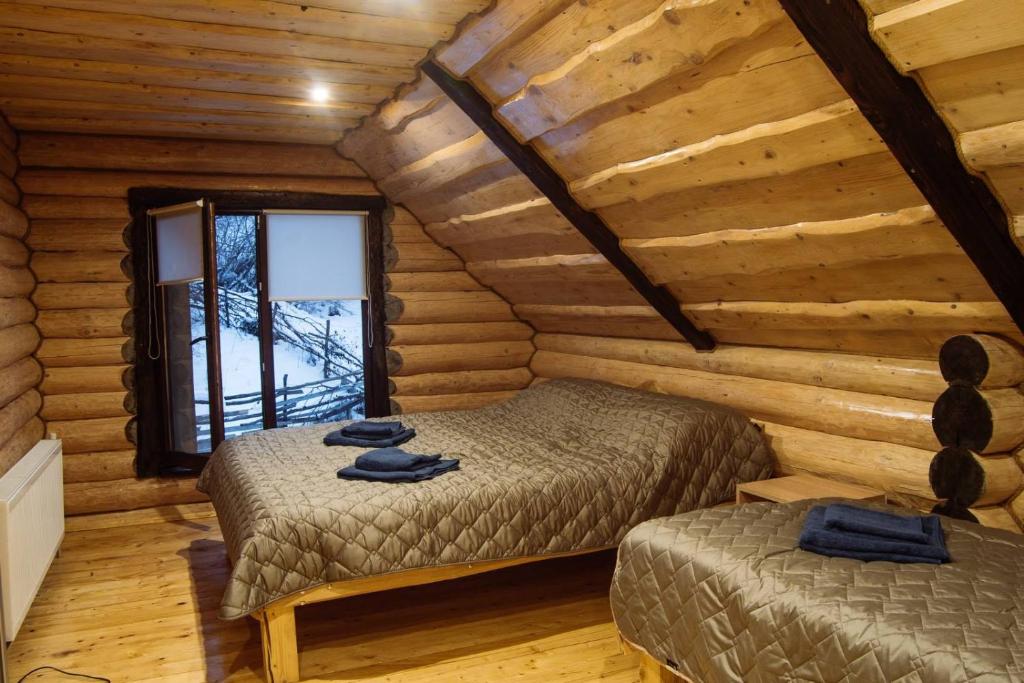 Postel nebo postele na pokoji v ubytování садиба Шепіт лісу