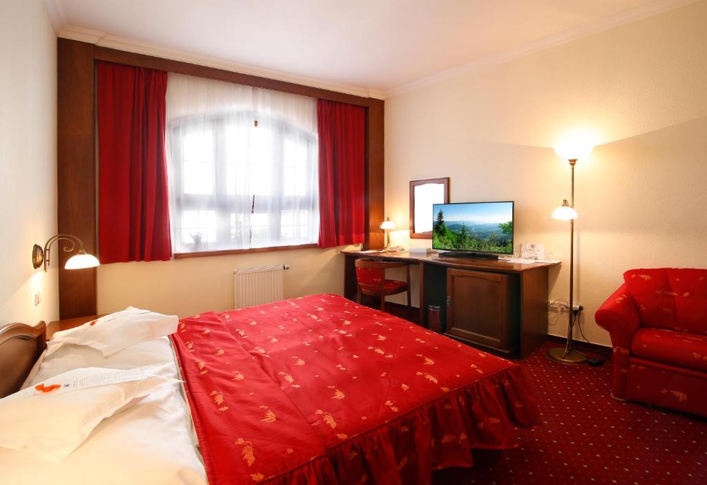 Postel nebo postele na pokoji v ubytování AGH Hotel