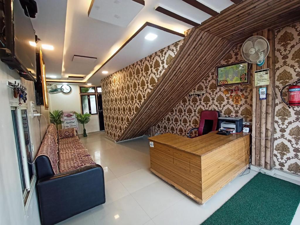 a lobby of a salon with a desk and chairs at Brajrani Hotel in Datia