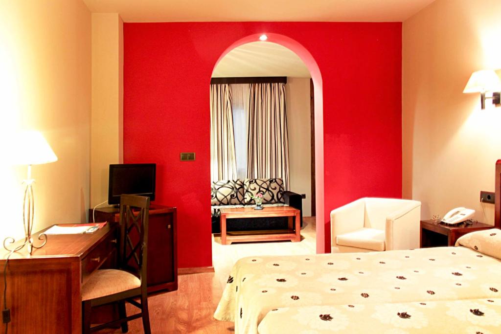 Postel nebo postele na pokoji v ubytování Hotel Zerbinetta