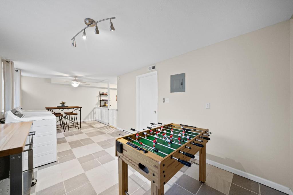 a game room with a foos ball on a table at Nanas Nook on Hickory Grove in Clarksville