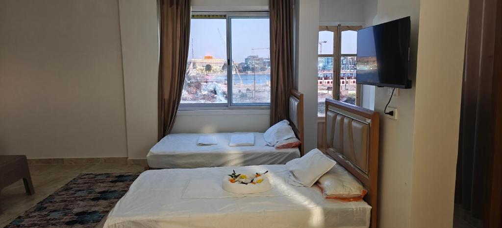 Postel nebo postele na pokoji v ubytování Morsy Palace