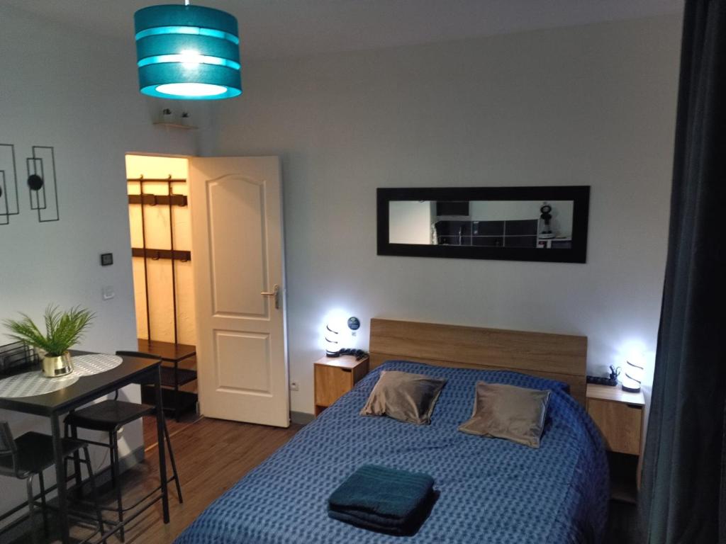 En eller flere senge i et værelse på Studio cœur de ville