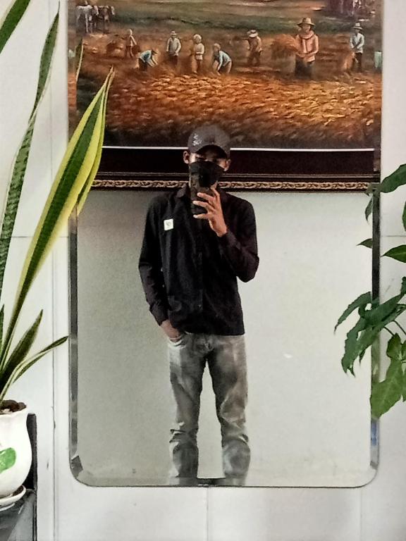 a man taking a picture of himself in a mirror at Brooklyn in Bantam Village