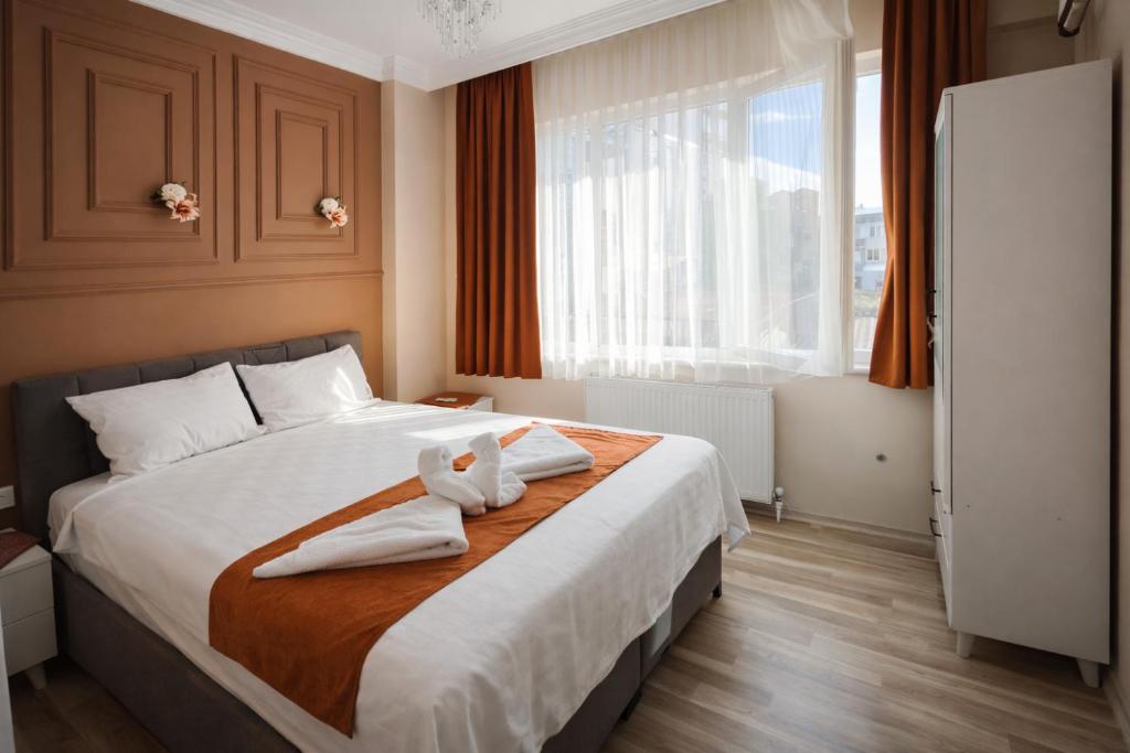 En eller flere senge i et værelse på Ayasofya Bella Vista APART