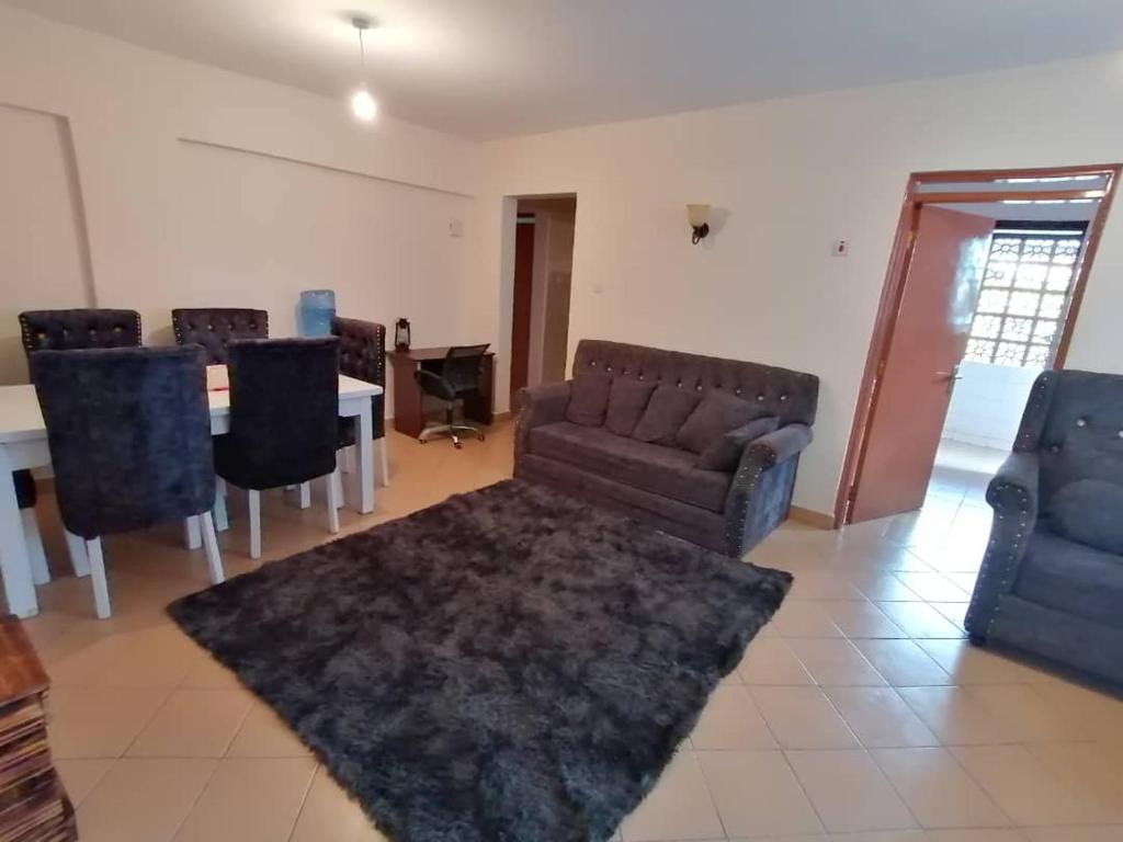 Χώρος καθιστικού στο Maya's 2bedroom Tawan