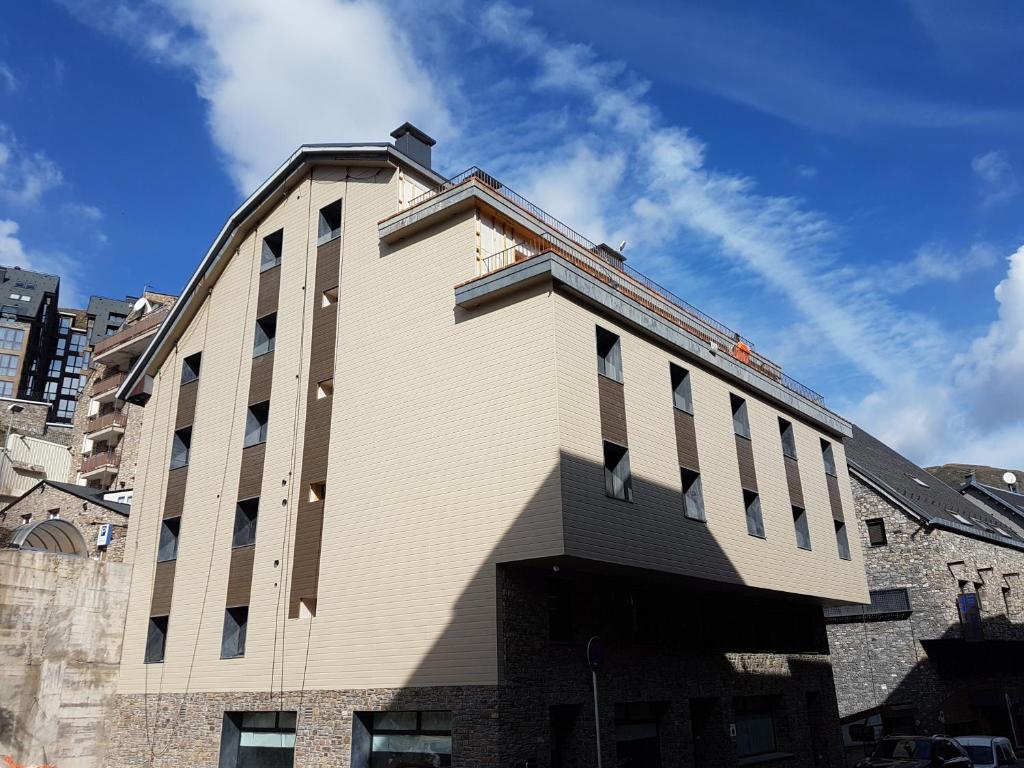 a large white building with a lot of windows at Hotel Guineu in Pas de la Casa