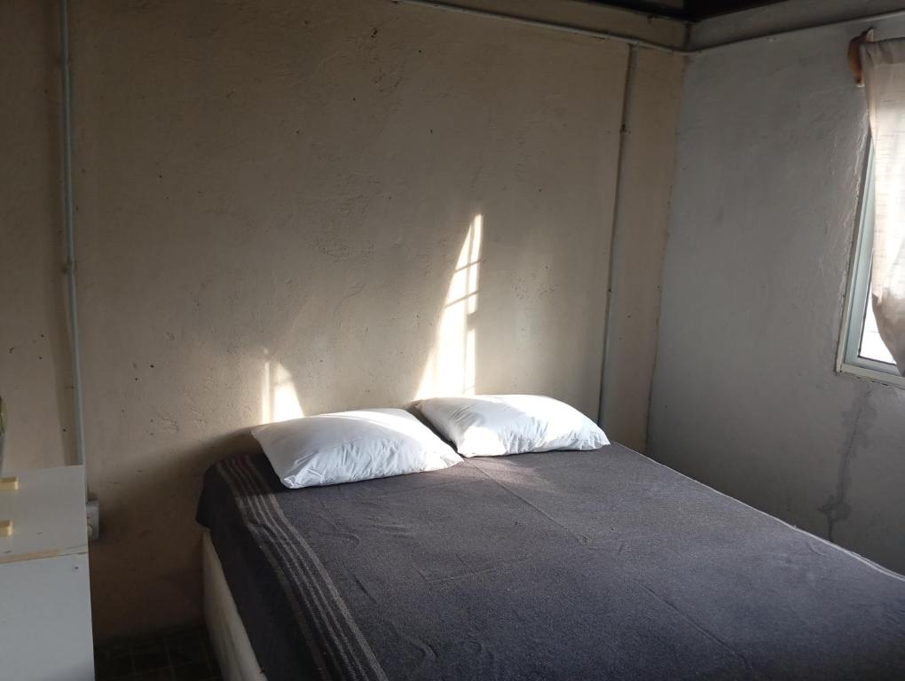 Postel nebo postele na pokoji v ubytování casita san luis