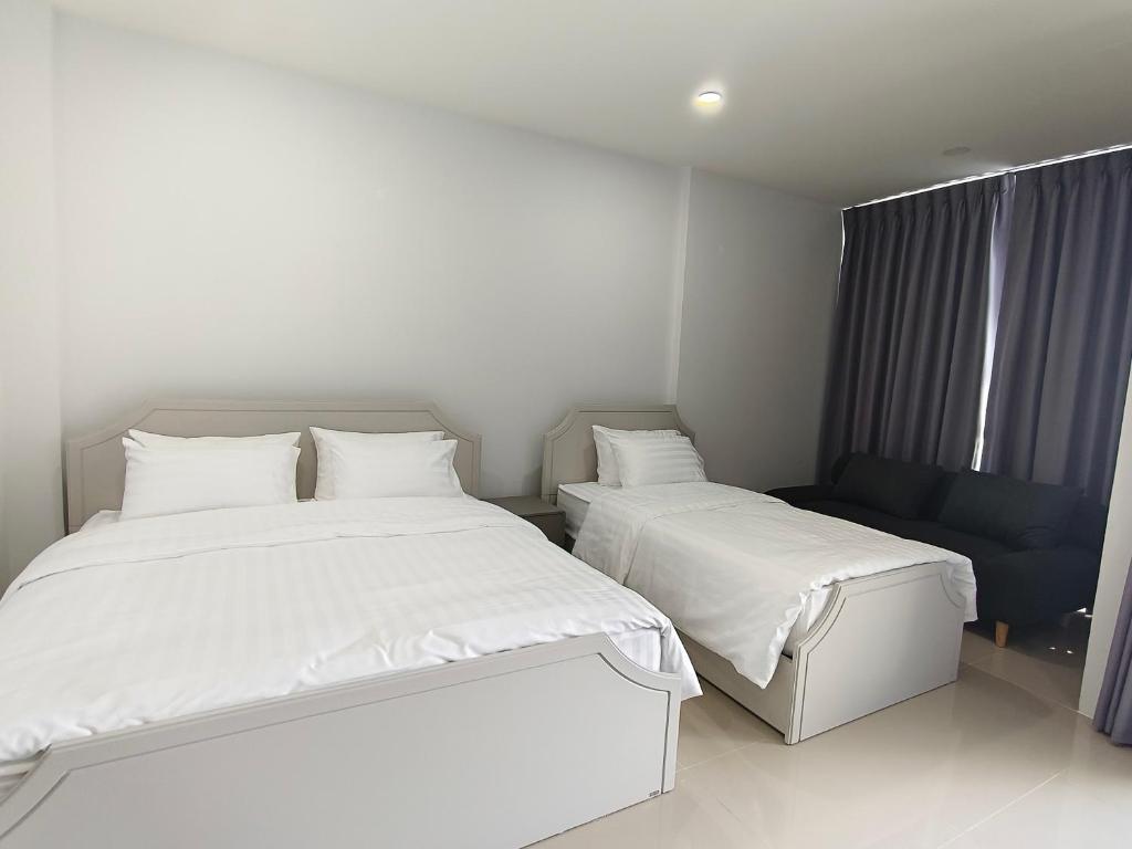 Postel nebo postele na pokoji v ubytování Airport Stay Phuket Zz