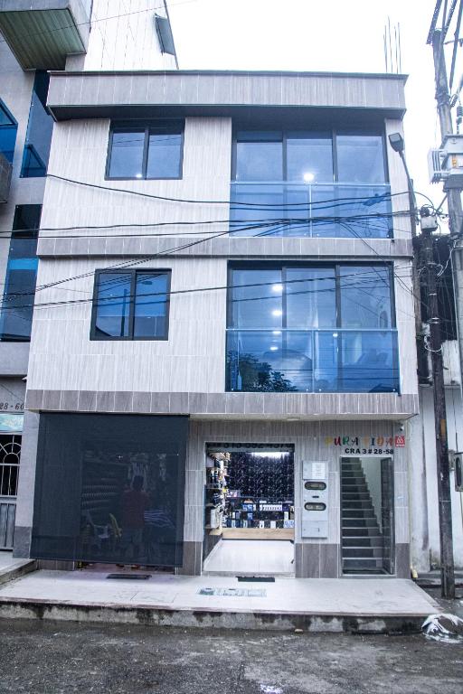 a tall building with a lot of windows at Pura Vida in Quibdó