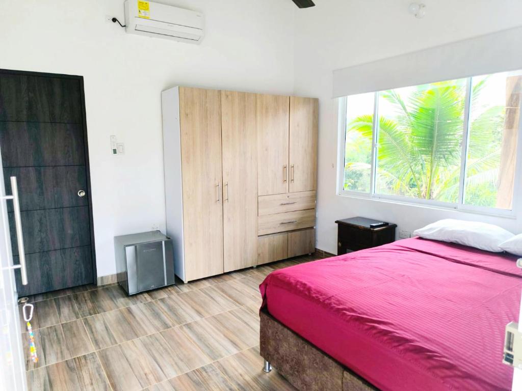 En eller flere senge i et værelse på Posada Campestre en Doradal