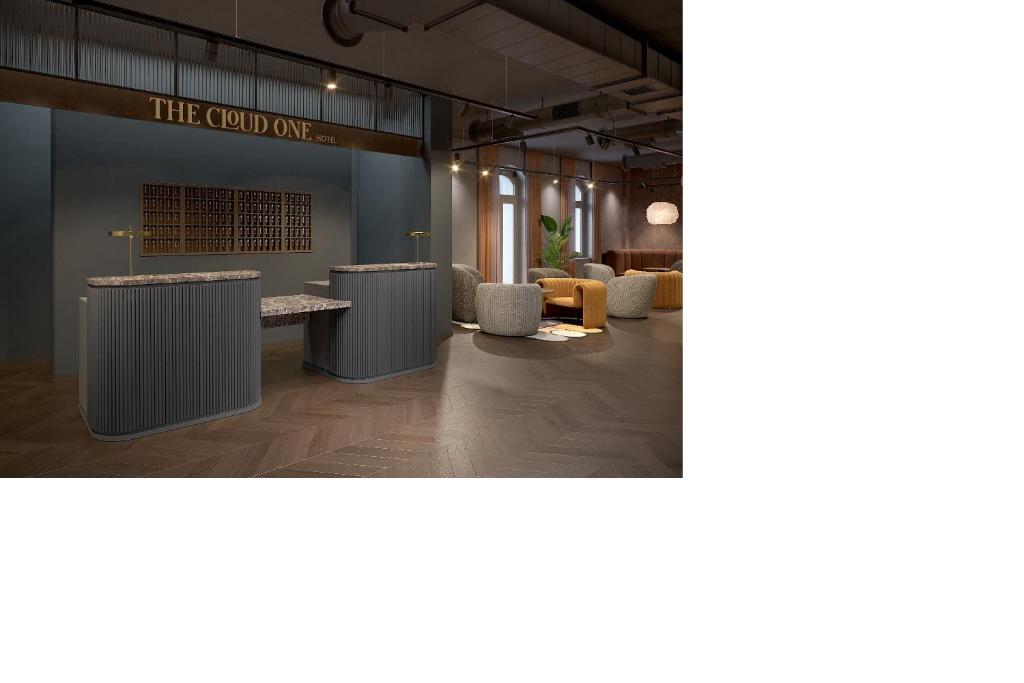 eine Lobby mit Sofas und Tischen in der Unterkunft The Cloud One Frankfurt - Metropolitan in Frankfurt am Main