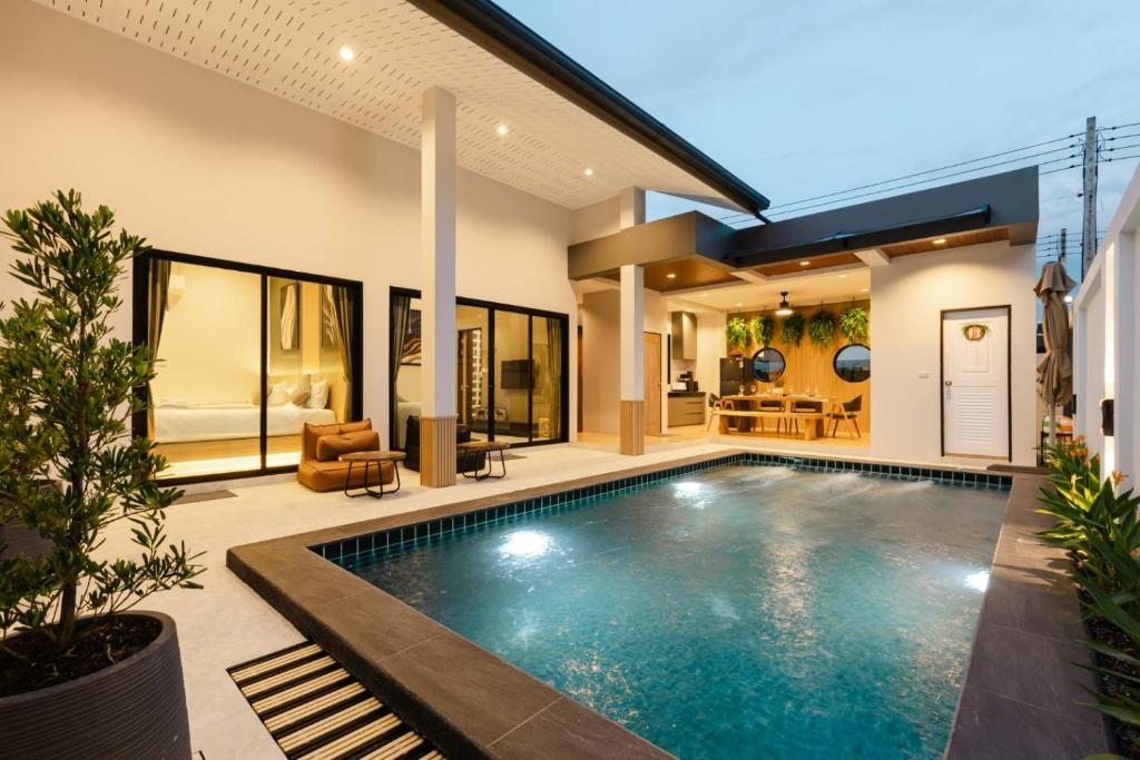 a swimming pool in the backyard of a house at Rivla A Pool Villa in Ao Nang 