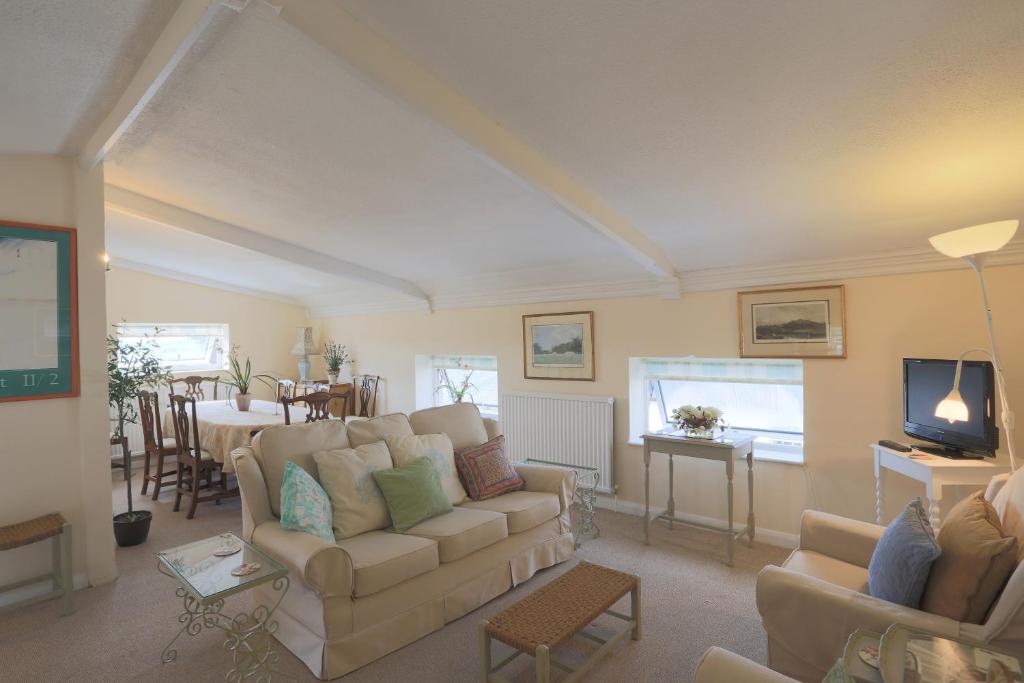 a living room with a couch and a table at The Old Chapel in Arundel