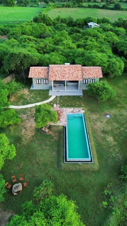 an aerial view of a house with a swimming pool at Wild loch yala in Kirinda