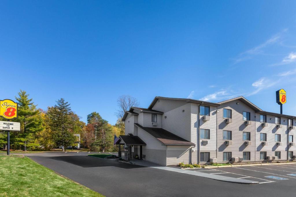 a building on a street next to a road at Super 8 by Wyndham Kent/Akron Area in Kent