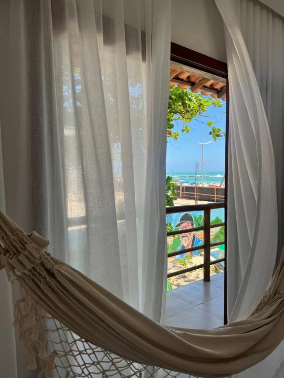 En balkon eller terrasse på Casa Vista Mar - Praia do Frances