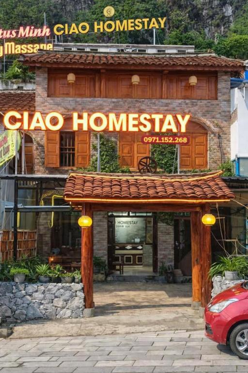a sign for a clico homesteadery in front of a building at Ciao Homestay in Dồng Văn