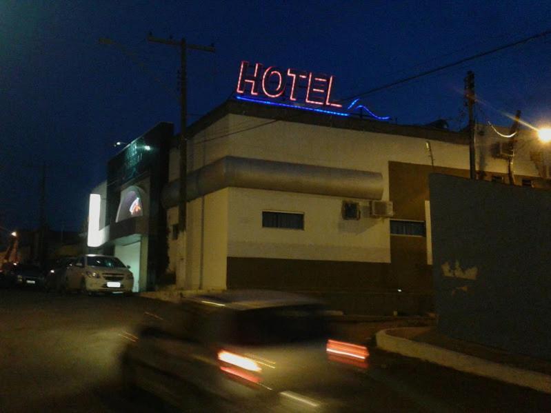 a hotel sign on top of a building at night at Hotel Rio Araguaia Xambioá TO in Xambioá