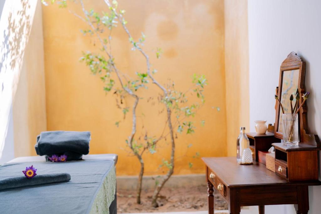 Giường trong phòng chung tại Rekawa Wellness Resort