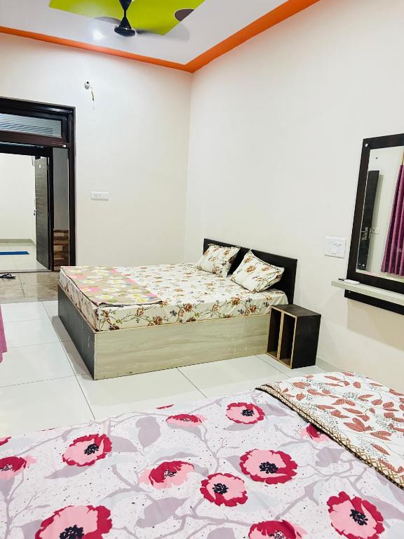 a bedroom with two beds in a room at New hotel Arjun place, Reengus in Rīngas