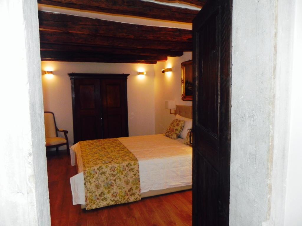 A bed or beds in a room at Home Venice Apartments-Rialto 1 - 2 - 3