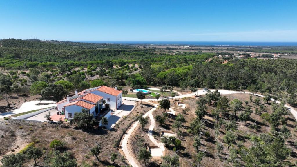 an aerial view of a house on a hill at Monte da Silveira in São Teotónio