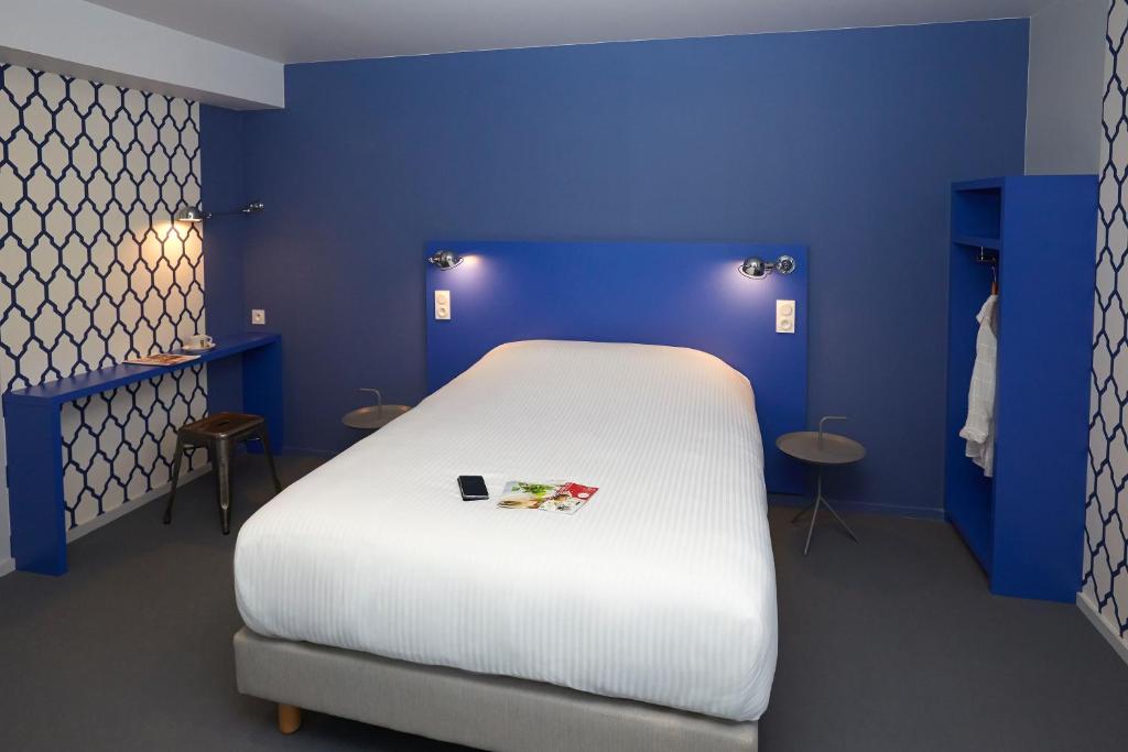 Postel nebo postele na pokoji v ubytování Coto Hotel
