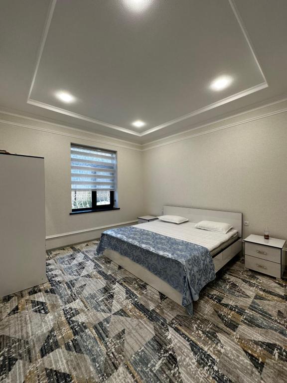 Postel nebo postele na pokoji v ubytování Hotel Turist Samarkand