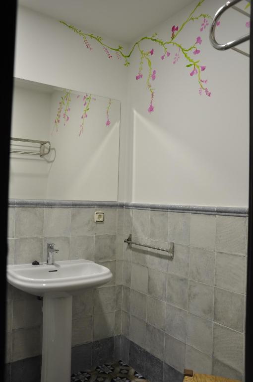 a bathroom with a sink and a shower at Casa de las Remigias in Estepona