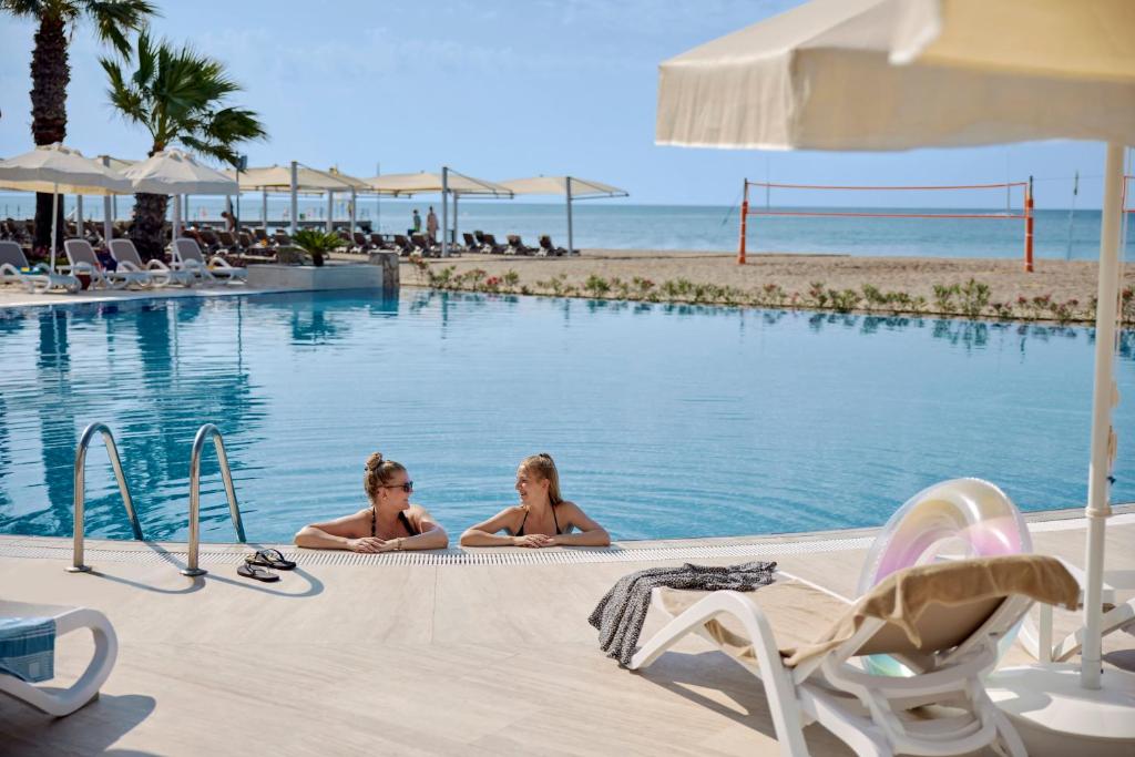 two girls laying in the swimming pool at the beach at TUI MAGIC LIFE Belek in Belek
