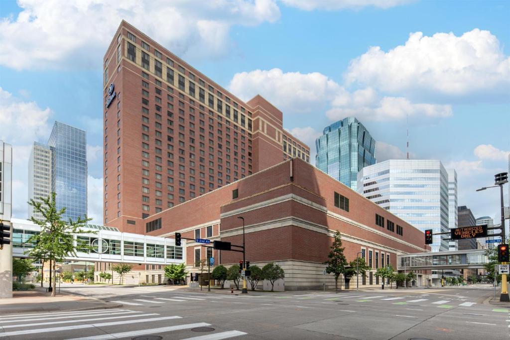 a large brick building in the middle of a city at Hilton Minneapolis in Minneapolis