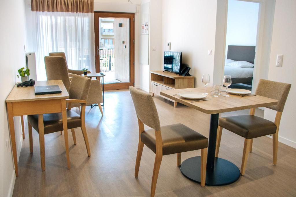 TV a/nebo společenská místnost v ubytování Résidence Nouvelles Sylphides Carrières-sous-Poissy