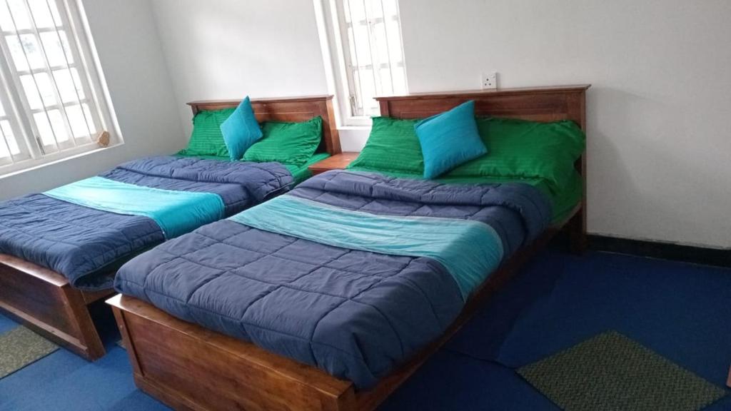 En eller flere senge i et værelse på Frosty Heaven Guest House