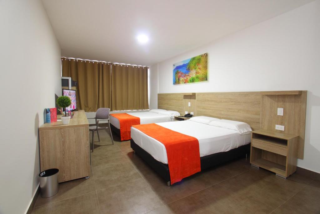 Postel nebo postele na pokoji v ubytování Hotel Genova Centro