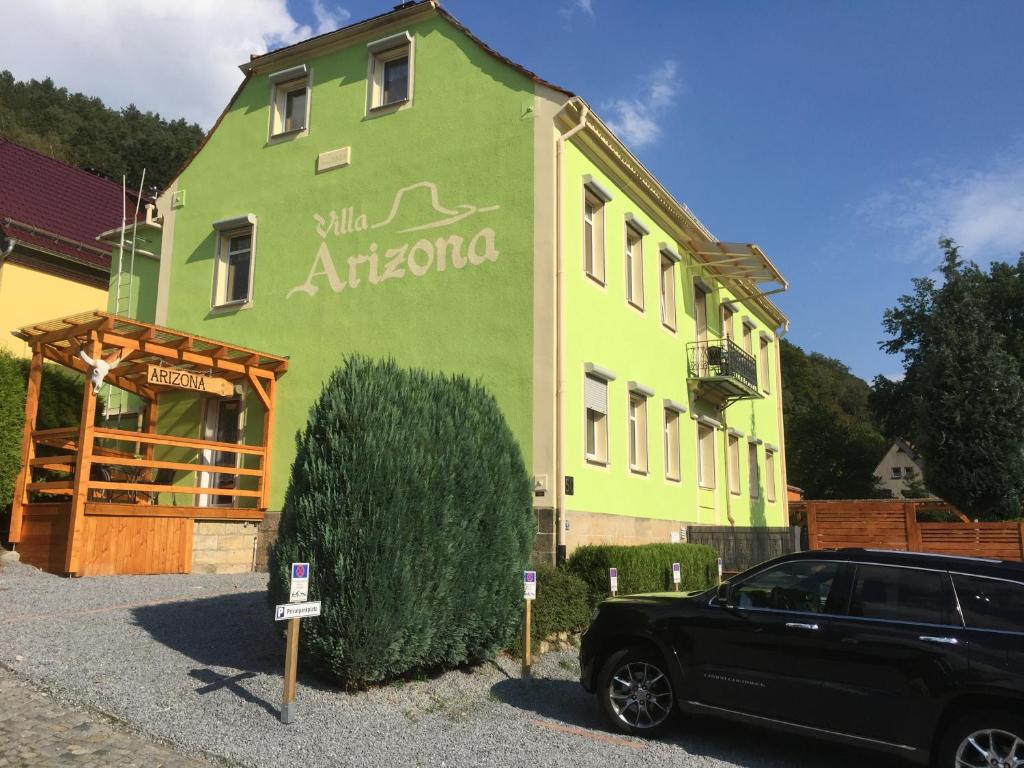 a black car parked in front of a building at Villa Arizona in Bad Schandau