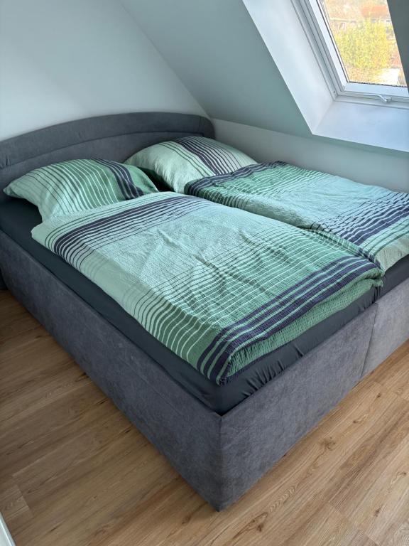 En eller flere senge i et værelse på Ferienhaus Wesloer Landstraße 6b