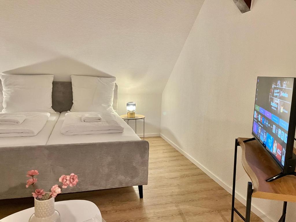 Giường trong phòng chung tại City Studio mit WLAN