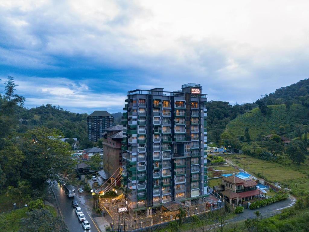 an overhead view of a tall building in a city at MYSA Sky Suites, Lakkidi in Vythiri