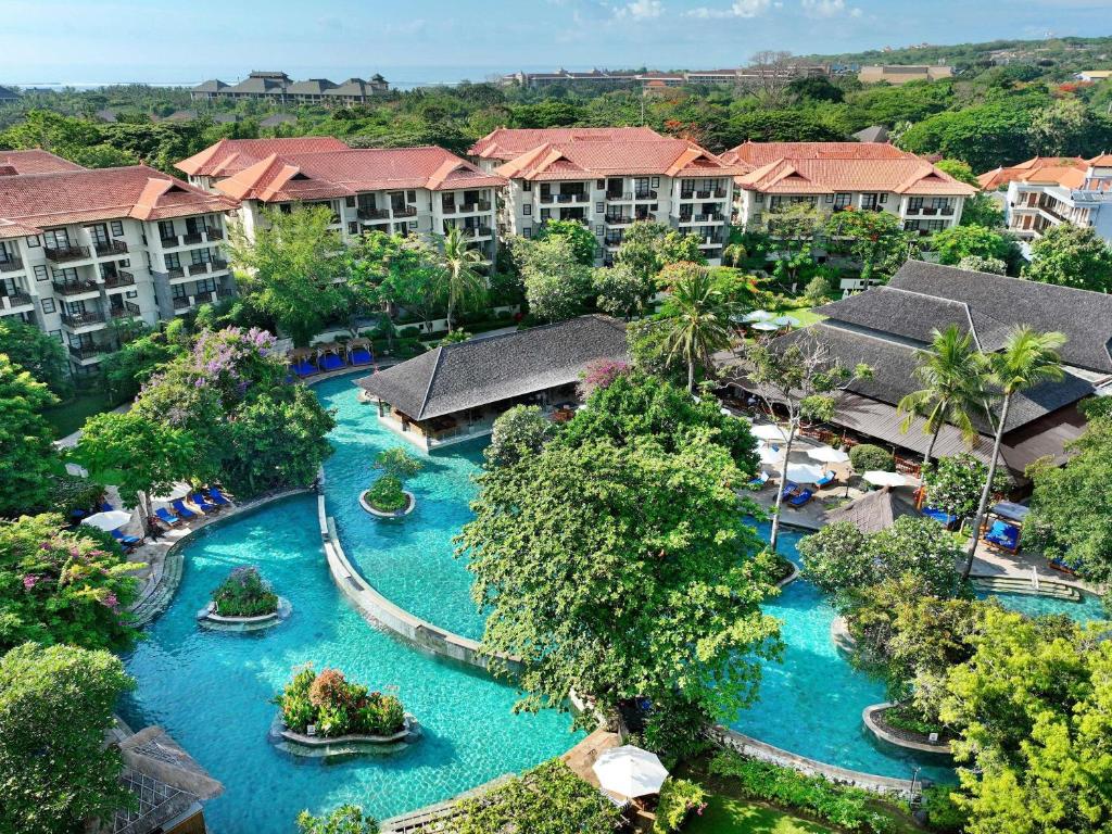 an aerial view of a resort with blue water at Novotel Bali Nusa Dua in Nusa Dua