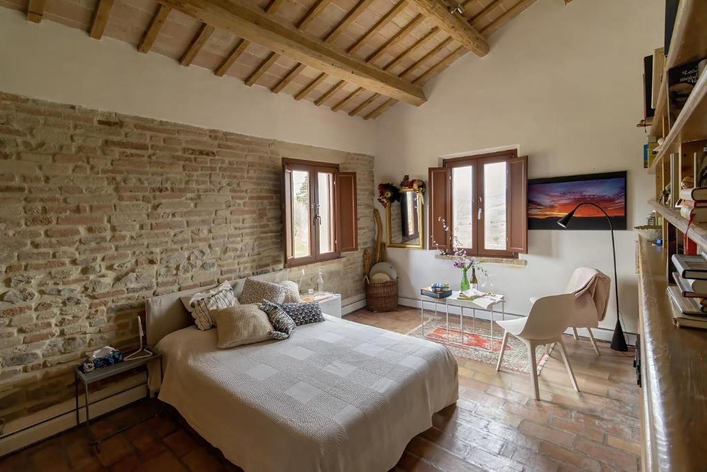 En eller flere senge i et værelse på Quindici Alberi B&B