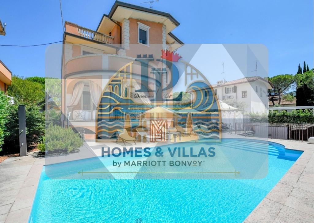 een weerspiegeling van een huis en villa's in een raam bij Villa Bugatti DesenzanoLoft Official Partner Homes & Villas by Marriott Bonvoy in Desenzano del Garda