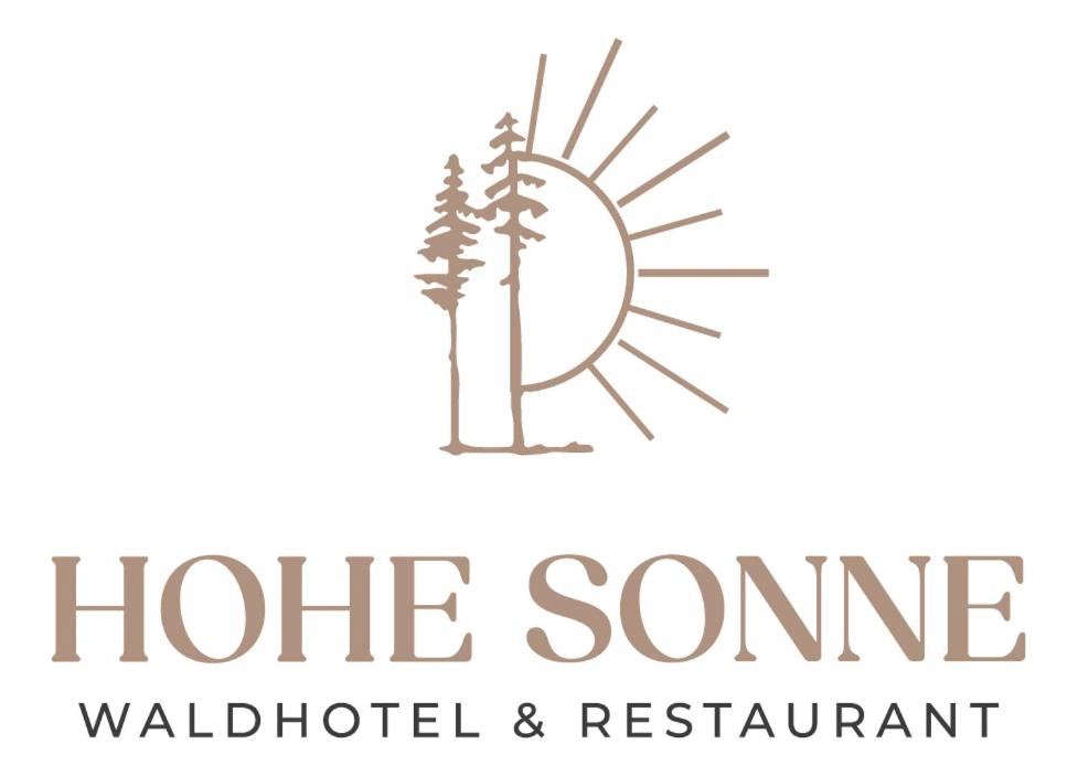 een logo voor het White Cone Wildlife Collaborative Wilderness and Restaurant bij Waldhotel Hohe Sonne in Eisenach