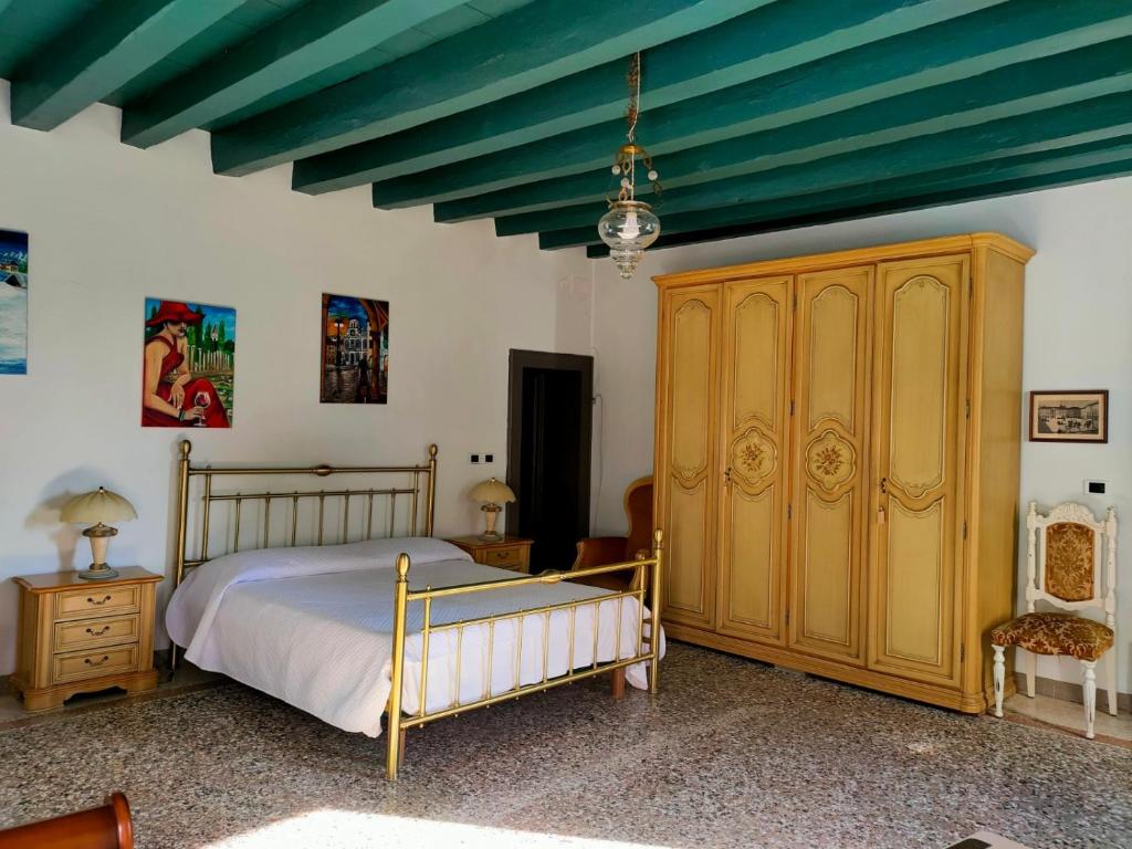 Postel nebo postele na pokoji v ubytování Villa Trigatti