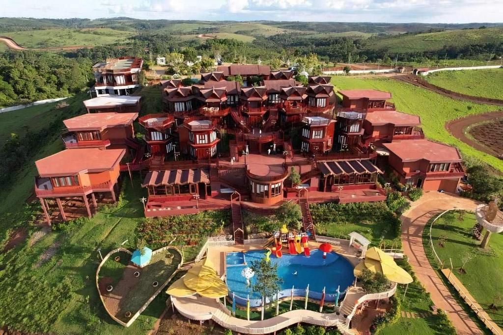 an aerial view of a large house with a pool at Phum Rottanak Resort - Mondulkiri 