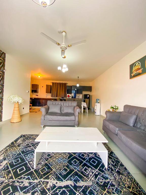 a living room with a couch and a coffee table at Bella luxury homes in Mombasa