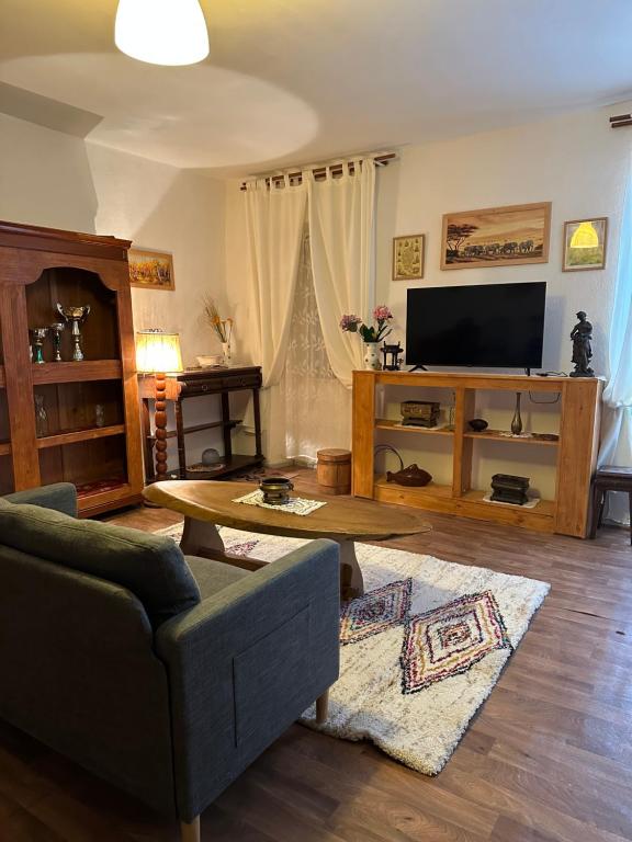 a living room with a couch and a coffee table at Casa Bella Centre de Corsica in Corte