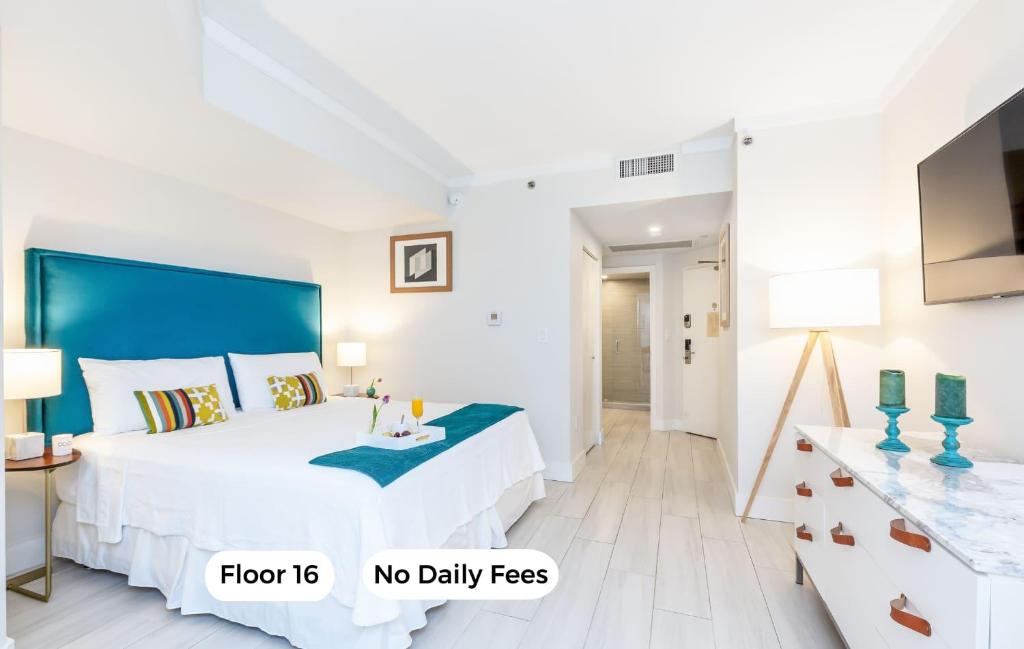 En eller flere senge i et værelse på MVR Suite with Access to Miami-s Best Rooftop