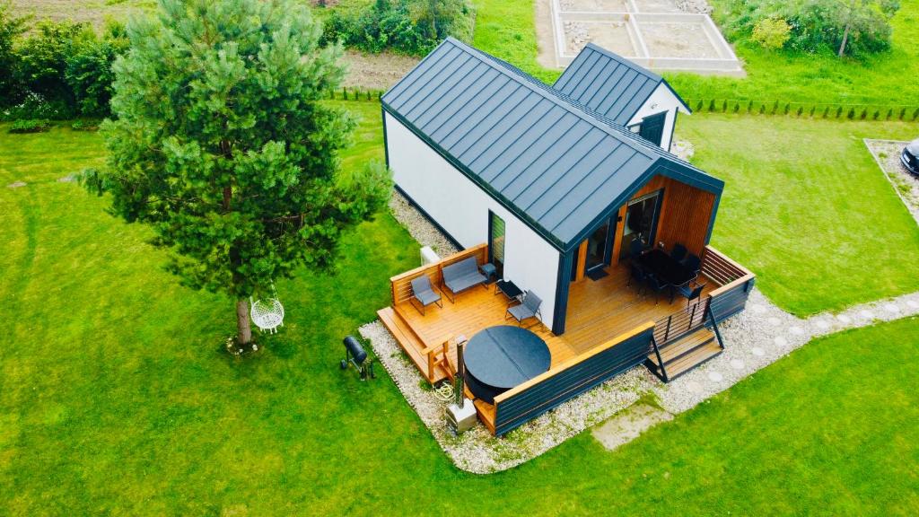 an overhead view of a tiny house with a porch at Chill House in Anykščiai